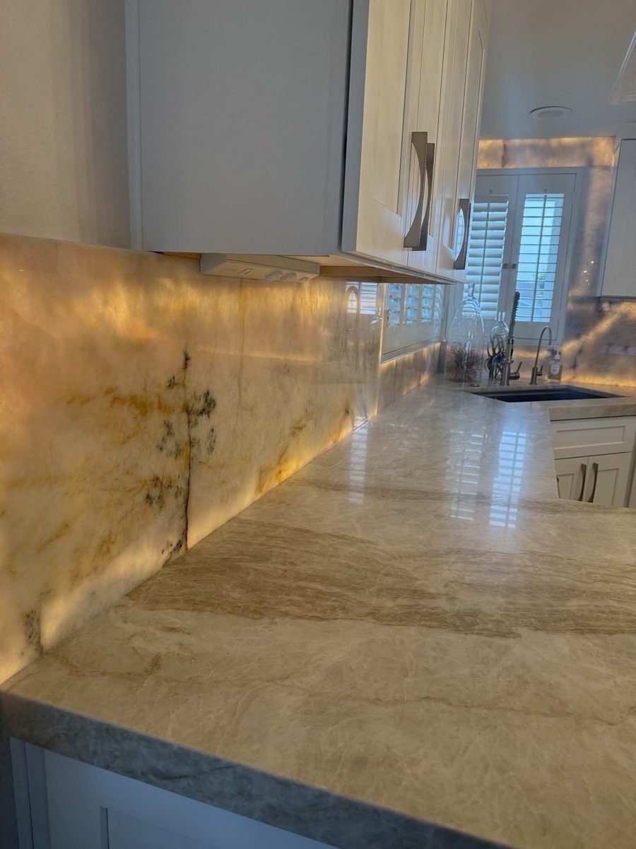 Custom onyx backsplash and quartzite stonework